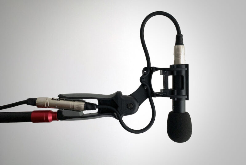 Talking head video: picture of microphone on a boom pole to represent audio capture