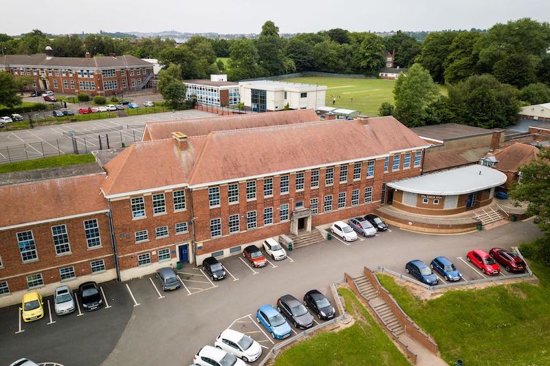 School promotional photography example of an aerial shot of imposing school buildings.