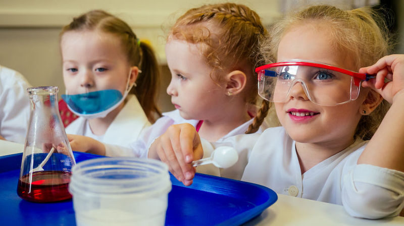 School children doing a science lesson used for school promotional video