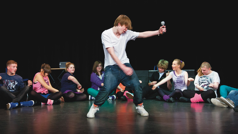 A scene from a school production of the musical Fame