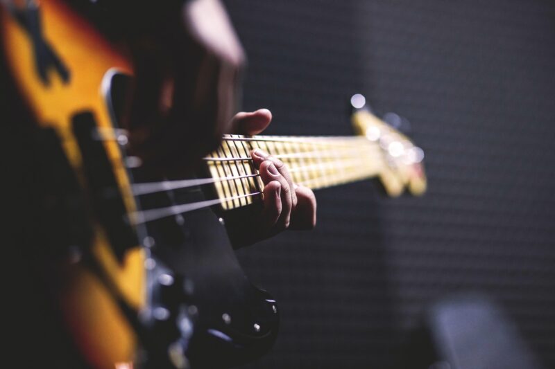 Picture of musician playing a bass guitar to illustrate my guitar and bass lessons